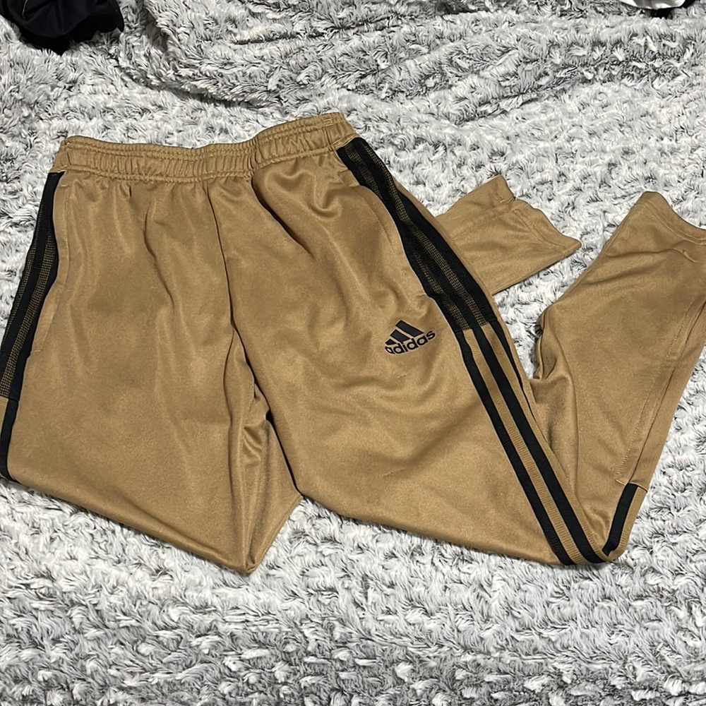 Gold and black adidas track pants